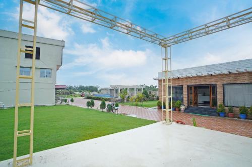 a view from the back yard of a house at Holiday Beach Resort !! Beach Distance 50 Mts !! in Mandarmoni