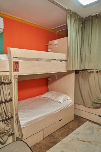 a bunk bed room with two bunk beds in it at day to day in Almaty
