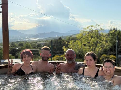 a group of people standing in a hot tub at Agriturismo Statale 17 in Poggio Picenze