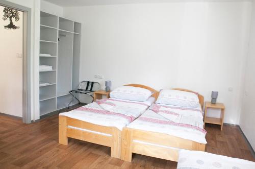 a bedroom with a bed with two pillows on it at Autocamp Slunce Žandov in Žandov