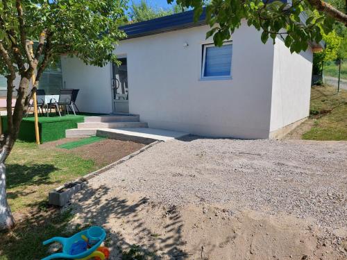 a childs toy in front of a house at Apartman Alina&Alan 2 in Bihać