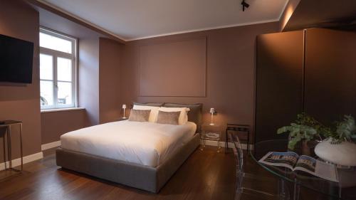 Postel nebo postele na pokoji v ubytování Dimora Vianello Rooms