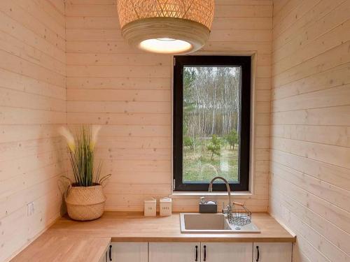 a kitchen with a sink and a window at PolanaKubicy,pl in Nowe Miasto
