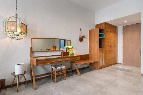 a dressing room with a desk and a mirror at La Villa Langkawi - Private Pool in Pantai Cenang