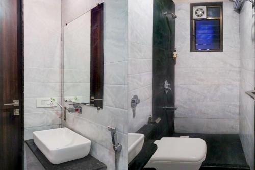 a bathroom with a toilet and a sink at Townhouse Viman Nagar in Pune