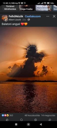 a picture of a cloud in the sunset at Villa Fonyód in Fonyód