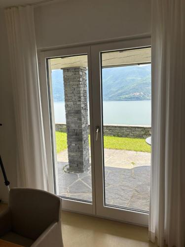a room with a sliding glass door with a view at Casa Panorama in Brissago