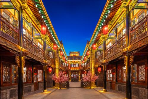 an arcade with red lights in a building at Xingshengjiu Courtyard Hotel Pingyao in Pingyao