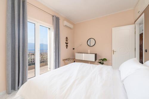 Кровать или кровати в номере Elaia Retreat by Greece Apartments