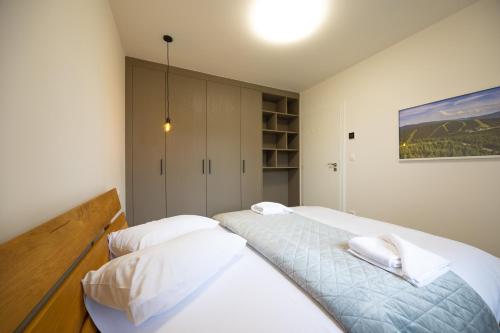 Postel nebo postele na pokoji v ubytování Apartmány u Josífka Velké Losiny