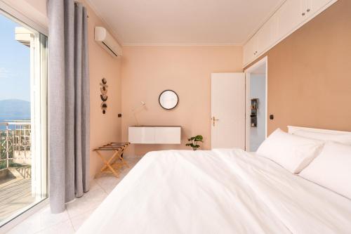 Кровать или кровати в номере Elaia Retreat by Greece Apartments