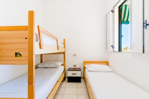 Ένα ή περισσότερα κρεβάτια σε δωμάτιο στο Appartamento Vista Mare