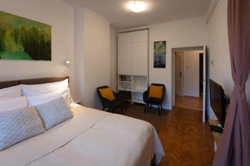 Posteľ alebo postele v izbe v ubytovaní Sunbird Apartman Budapest