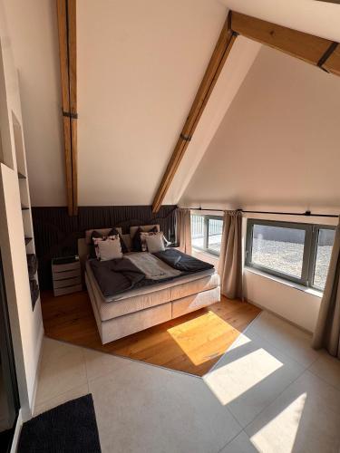 a bedroom with a bed in the middle of a room at Casa Fux in Grassnitzberg