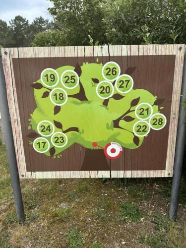 a sign with a picture of a tree on it at Les bruyeres in Brocas