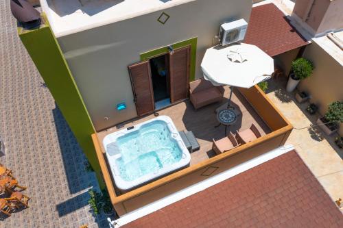 an overhead view of a swimming pool in a house at Asimenis Cottages in Kattavía