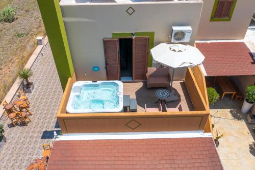 an overhead view of a toy house with a hot tub at Asimenis Cottages in Kattavía