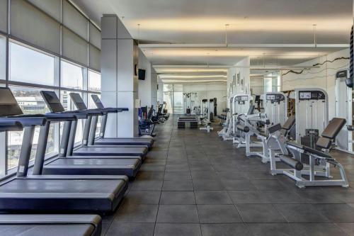 a gym with rows of treadmills and machines at The Westin Santa Fe, Mexico City in Mexico City