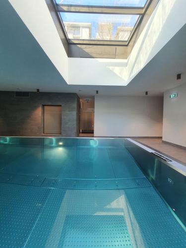 an empty swimming pool with a skylight in a building at Hotel the YARD Berlin in Berlin