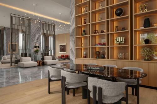 a dining room with a table and chairs at Courtyard by Marriott Prishtina in Pristina