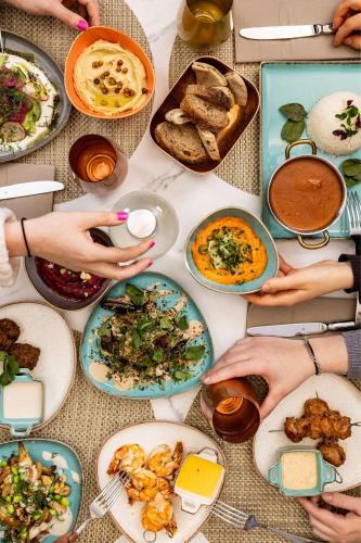 a table full of plates of food on a table at Courtyard by Marriott Berlin City Center in Berlin
