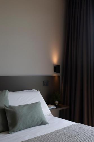 Postel nebo postele na pokoji v ubytování Scorzamara Country Lodges