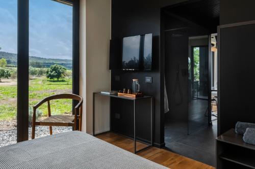 TV a/nebo společenská místnost v ubytování Scorzamara Country Lodges