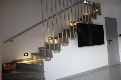 a flat screen tv on a wall in a building at Villa L&M in Bihać