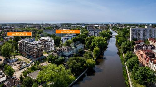an aerial view of a city with a river at Wyspa Solna, Sun & Snow in Kołobrzeg