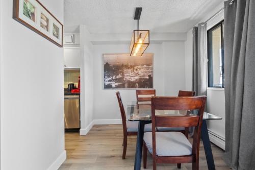 a dining room with a table and chairs at Suite near Downtown, BMO, Stampede, Free Parking in Calgary