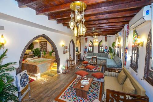 a living room with a large room with a tub at Sultana Downtown Cairo Hot Tub Retreat in Cairo