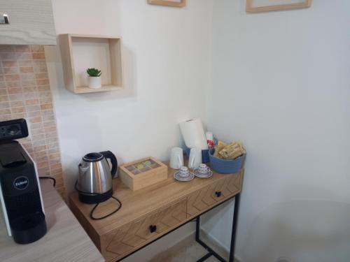 a counter with a coffee maker on it in a kitchen at Chalet sul Mare in Ladispoli