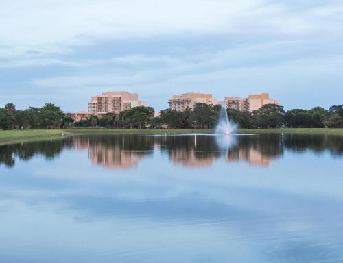 a view of a lake with a city in the background at Wyndham Palm-Aire Studio Apartment with Resort Access in Pompano Beach
