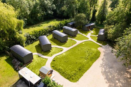 an aerial view of a garden with several structures at The Bell Inn, Ladbroke in Ladbroke