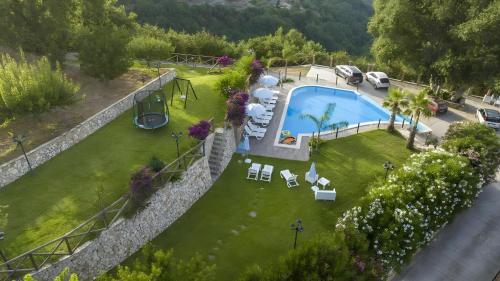 an overhead view of a backyard with a swimming pool at Arcaloro Resort Rooms in SantʼAngelo di Brolo