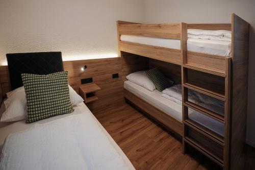 a small room with a bunk bed and a bunk bed at Be Grand Apartments Rust in Rust