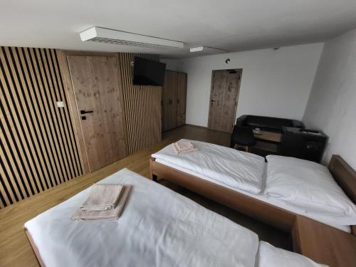 Postel nebo postele na pokoji v ubytování Penzion DRUCKER