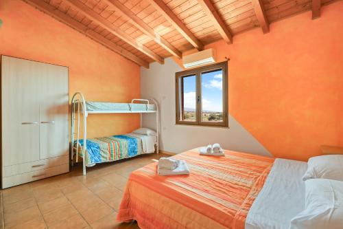 Ένα ή περισσότερα κρεβάτια σε δωμάτιο στο Agriturismo Su Nuratolu