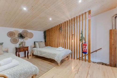 Postel nebo postele na pokoji v ubytování A Casa de Pedra