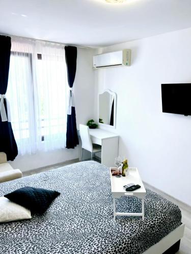 TV i/ili multimedijalni sistem u objektu Deva Apartments