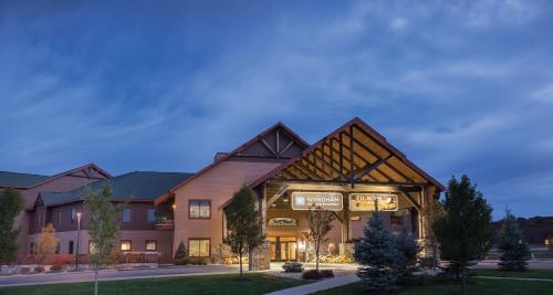 a building with a sign on the front of it at Wyndham Glacier Canyon 1BR Apartment with Resort Access in Baraboo