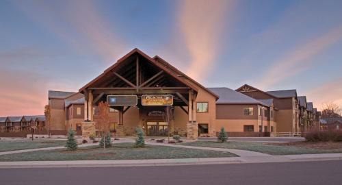 a building with a sign on the front of it at Wyndham Glacier Canyon 1BR Apartment with Resort Access in Baraboo