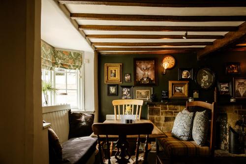 a living room with a couch and a table at The Bell Inn, Ladbroke in Ladbroke