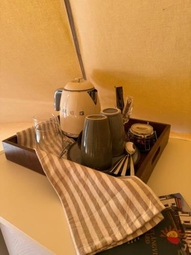a kitchen counter with a coffee maker on a tray at Söderlångvik Glamping in Söderlångvik