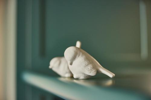 a figurine of a dolphin sitting on a shelf at The July - Boat & Co in Amsterdam