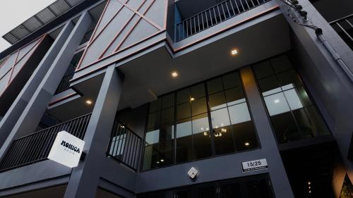 an office building with a sign in front of it at Monica Room