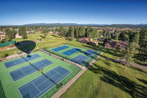 an overhead view of four tennis courts on a field at Wyndham Pagosa Springs 1BR Apartment with Resort Access in Pagosa Springs