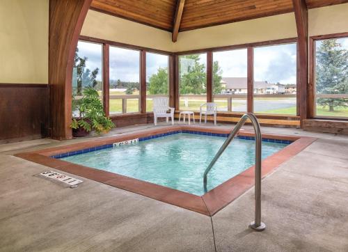 a swimming pool in a house with windows at Wyndham Pagosa Springs 1BR Apartment with Resort Access in Pagosa Springs