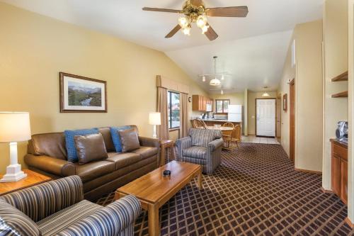 a living room with a couch and a table at Wyndham Pagosa Springs 1BR Apartment with Resort Access in Pagosa Springs