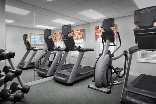 a row of treadmills and exercise bikes in a gym at Residence Inn Spokane East Valley in Spokane Valley